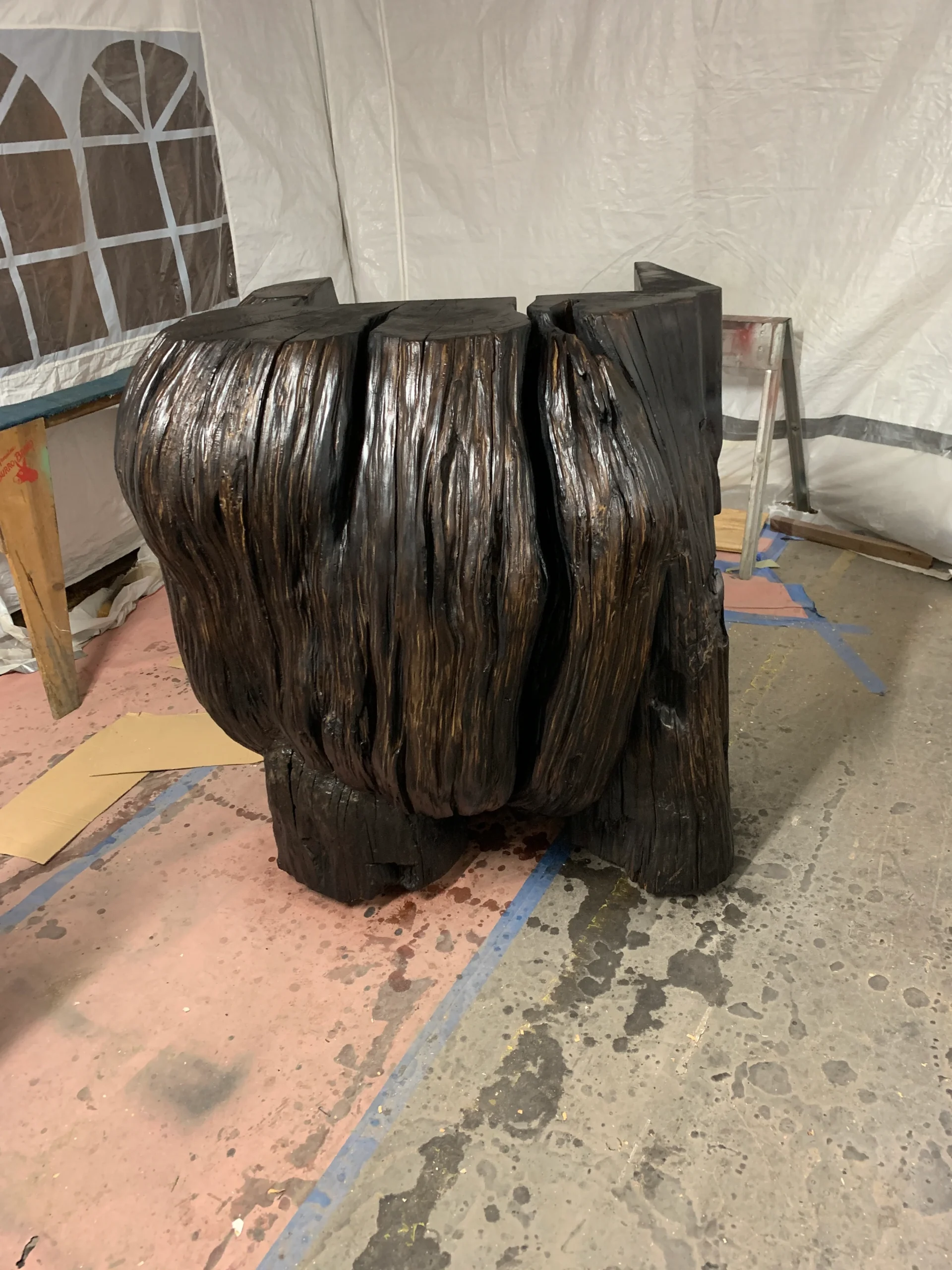 First we charred the whole trunk with fire then sealed it and its time to put flat clear coat on it.