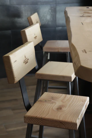 It turned out fresh and modern, and most importantly reliable, we designed the frames of the chairs and made massive tabletops from live edge Douglas Fir.
