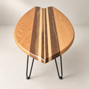 Walnut and oak surfboard coffee table with black hairpin legs